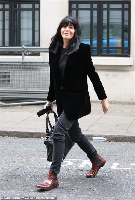 Claudia Winkleman oozes chic in black blazer and killer boots。